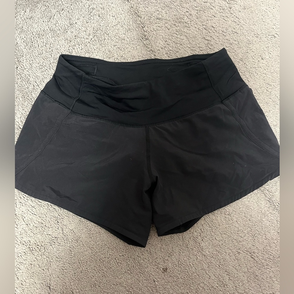 Lululemon black speed up shorts. Size 4